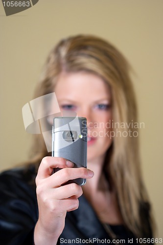 Image of Teen girl taking a photo