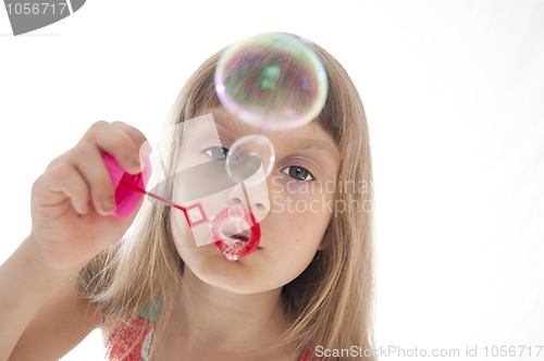 Image of child blowing bubbles