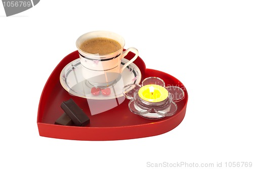 Image of Romantic breakfast with chocolate on red heart shaped tray with candle