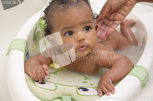 Image of Baby girl taking a bath