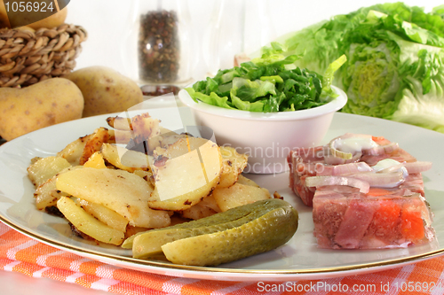 Image of Fried potatoes with meat jelly