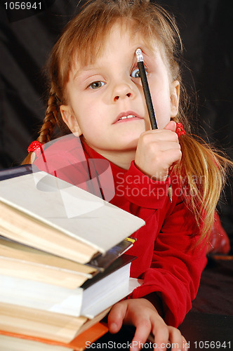 Image of little girl with books