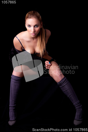 Image of Beautiful and sexy blond woman sitting, wearing  lingerie