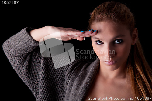 Image of beautiful woman saluting
