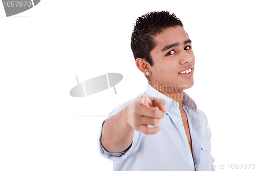 Image of young and happy latin man pointing