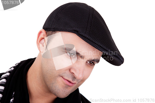 Image of Portrait of a man smiling with his black hat