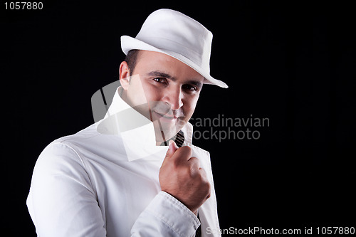 Image of smiling man with his white hat and coat