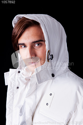 Image of Portrait of a young man  wearing a white coat with hood