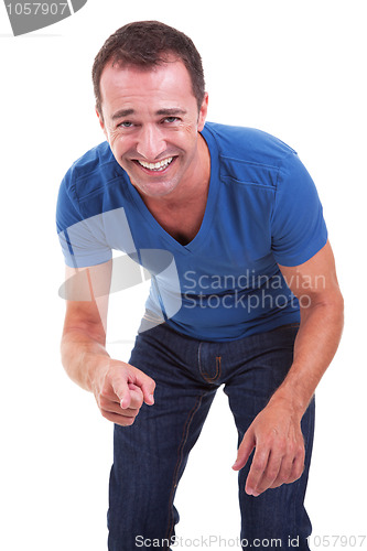 Image of Portrait of a handsome middle-age man, pointing and laughing, very happy