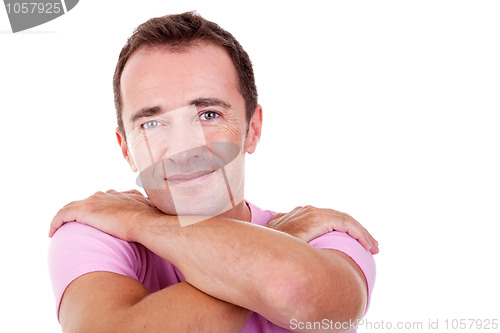 Image of Portrait of a handsome middle-age man, with arms crossed