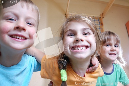 Image of happy kids playing at home