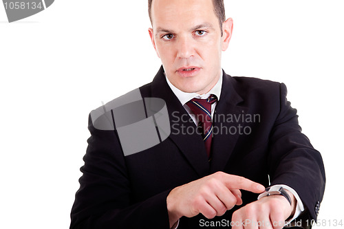 Image of upset businessman pointing to the watch