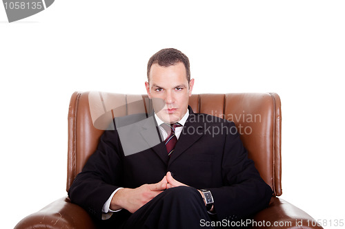 Image of Businessman seated on a chair