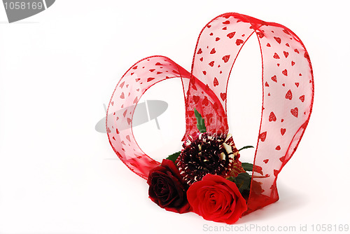 Image of Three different red tint roses with heart shaped  ribbon