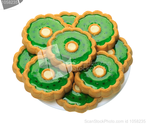 Image of Cookies with green jelly on white plate, isolated