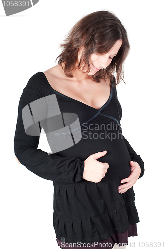 Image of Portrait of pretty pregnant woman in black dress