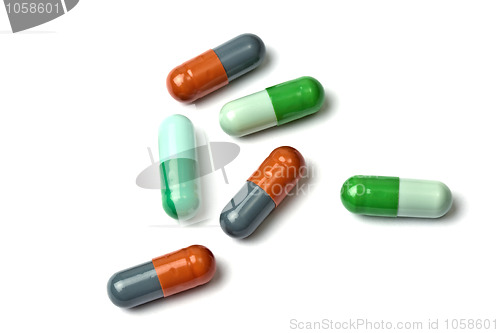 Image of A few colorful capsules isolated on white 