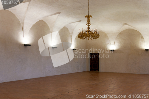 Image of Room in the castle with a gold chandelier