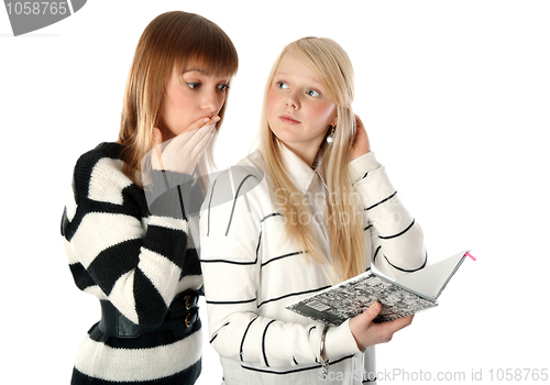 Image of Two beautiful girls read diary book on white background