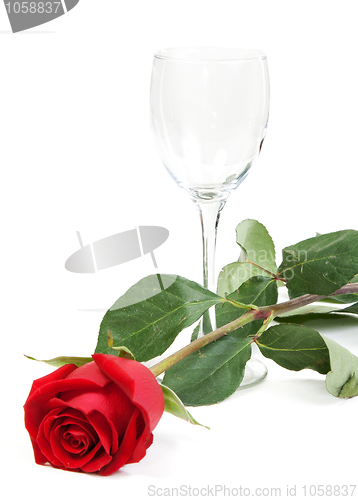 Image of Red rose and a glass cup