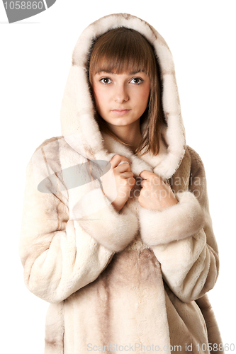 Image of A beautiful young girl in a fur coat