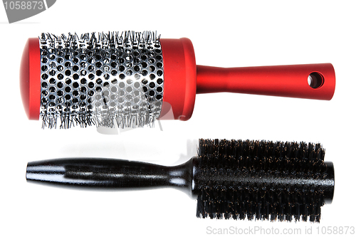 Image of Two red massages comb