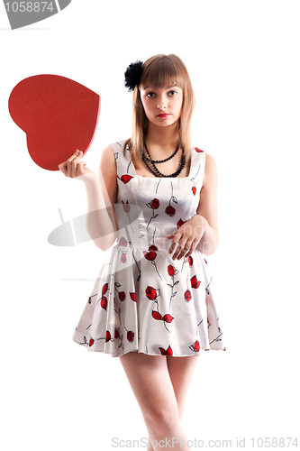 Image of Beautiful girl in gown with red colour and heart in hand