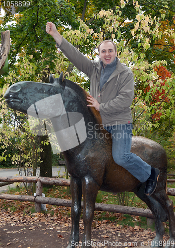 Image of Man on a brass horse monument