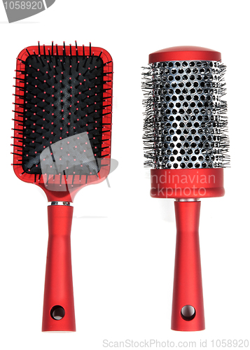 Image of Two red massages comb