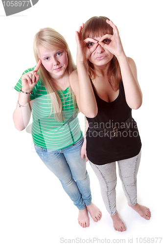Image of Two girls stand and make faces