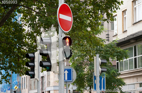 Image of Sign prohibits travel and traffic lights