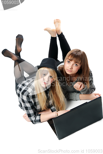 Image of Two girls lies with computer
