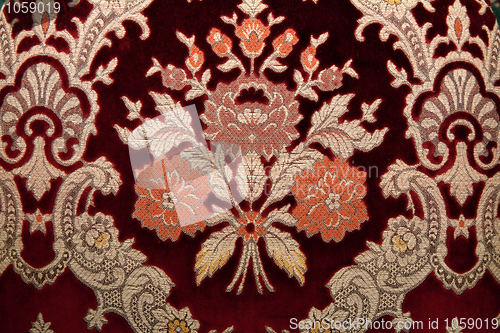 Image of Crimson fabrics with golden pattern