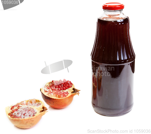 Image of Bottle of juice and ripe piece grenade