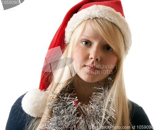 Image of A beautiful young blonde in a Santa hat