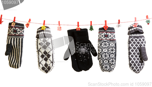 Image of Winter knitted gloves hang