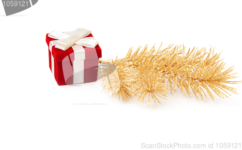 Image of Red and gold gift box with fir branches