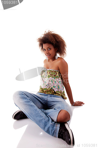 Image of beautiful black  woman, sitting on the floor