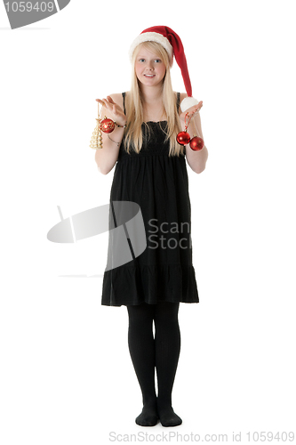 Image of Young beautiful girl in a Santa hat