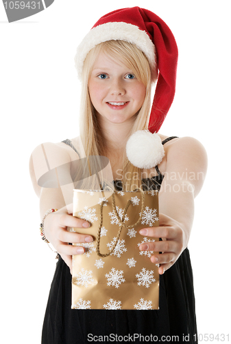 Image of Young beautiful girl in a Santa hat