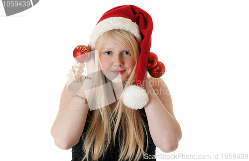 Image of Young beautiful girl in a Santa hat