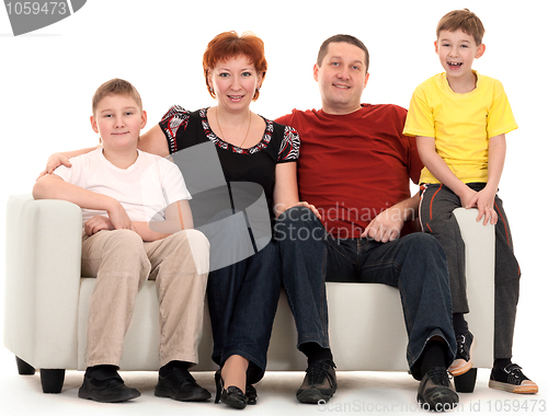 Image of Family of four on a sofa