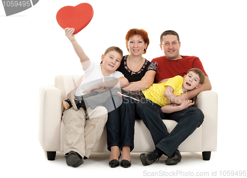 Image of Family of four on a sofa