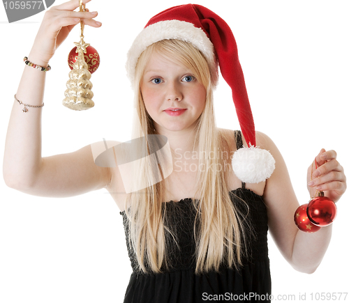 Image of Young beautiful girl in a Santa hat