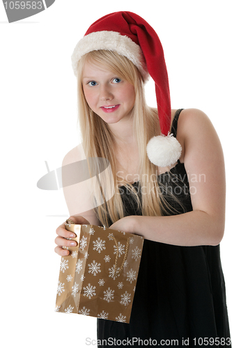 Image of Young beautiful girl in a Santa hat