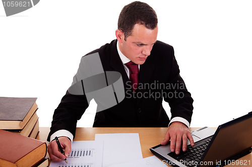 Image of businessman  working and  looking to computer
