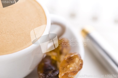 Image of notebook and cup of coffee