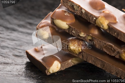 Image of Pile of broken chocolate with nuts