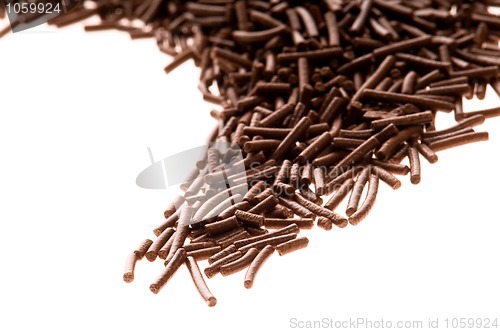 Image of chocolate sprinkles on white background