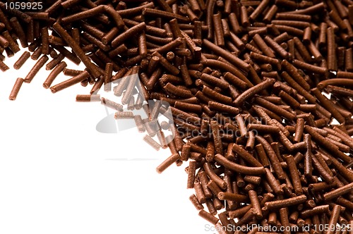 Image of chocolate sprinkles on white background